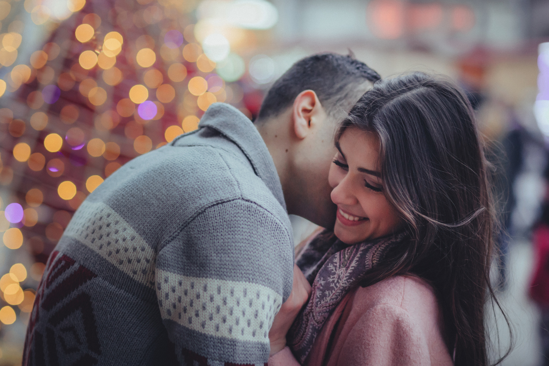 Man Kissing Woman